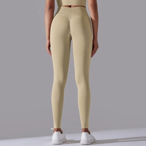 Close-up of high-waist seamless yoga leggings with heart-shaped stitching for a lifting effect