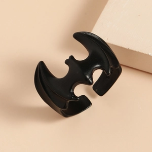 Close-up of gothic open bat ring with a matte black finish and sandblasted texture