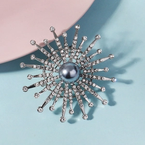 Silver sunburst brooch with grey pearl and sparkling rhinestones for party dresses