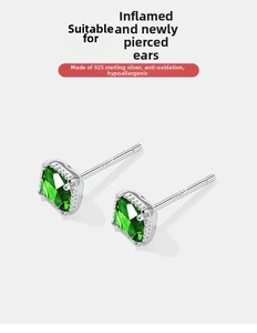 Macro shot of S925 sterling silver stamp on vintage emerald cut square stud earrings