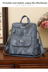 Detailansicht eines grauen Vintage-Rucksacks aus weichem Leder mit strukturierter Oberfläche