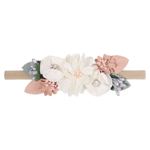 Detailed close-up of handmade fabric flowers on a soft nylon baby headband