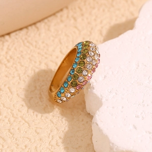 Macro detail of 18K gold-plated irregular ring with colorful pavé micro-set rhinestones