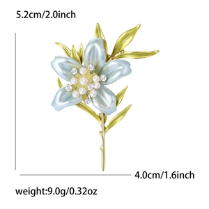 Detail view of enamel lily brooch showing dimensions 5.2x4.0cm and weight 9.0g