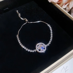 Detailed macro of crystal flower bracelet with adjustable bolo clasp in a gift box