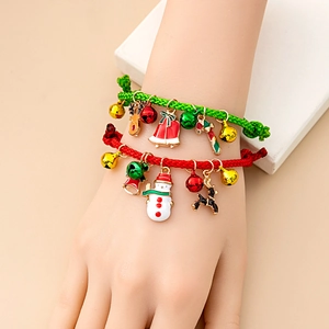 Christmas woven charm bracelet with reindeer, bells and snowman pendants on wrist
