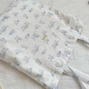 Close-up of cute blue cat prints on high-capacity white cotton canvas tote bag