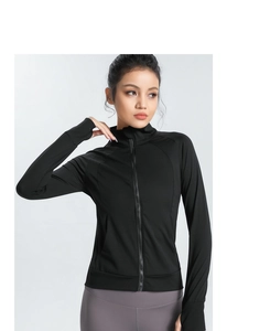Detail of slim fit black yoga jacket featuring stand collar and thumbhole cuffs