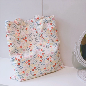 Detail of floral cotton tote bag with vintage fabric pattern and Animal pattern label