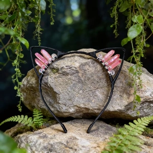 Detail of pink crystal cat ear headband with handmade wrap on mossy forest rocks