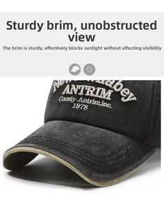 Detail view of the embroidered 1978 letters on a vintage washed grey baseball cap