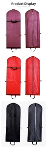 Detail of non-woven wedding dress dust cover with sturdy handles and central zipper