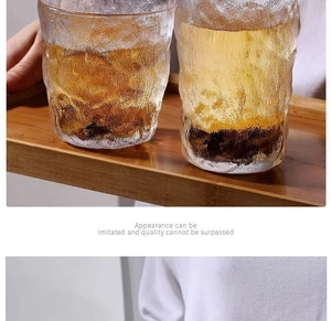 Detail of heat-resistant glass cups with glacier texture and mountain-shaped base set