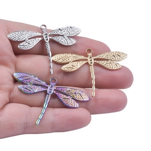 Dragonfly pendant necklaces in gold, silver and rainbow stainless steel with textured wings