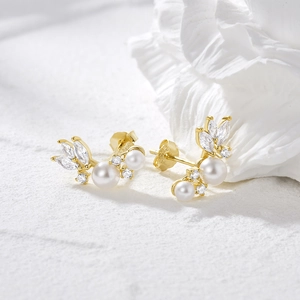 Elegant S925 silver gold pearl earrings with marquise zircon wing design on a white background