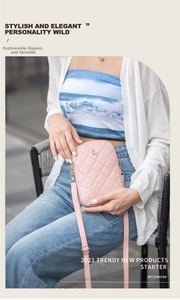 Pink quilted mobile phone bag with golden rose metal detail and adjustable strap