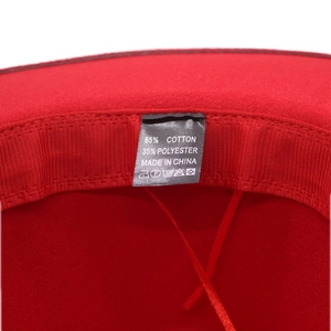 Detailed view of the fedora hat label showing 65% cotton and 35% polyester blend fabric
