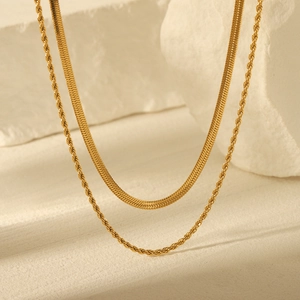 Double-layered gold stainless steel necklace featuring snake chain and twisted rope design