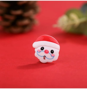 Macro shot of resin Santa Claus charm for DIY crafts and festive holiday ornaments