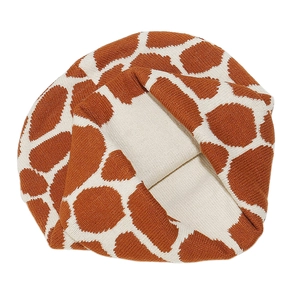 Macro detail of giraffe pattern jacquard knit beanie in caramel brown and off-white