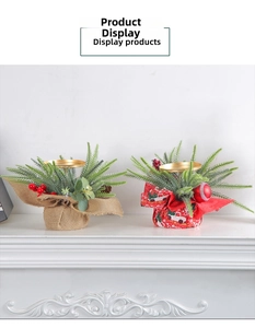 Close-up of Christmas candle holders with red berries and pine cones on a mantel
