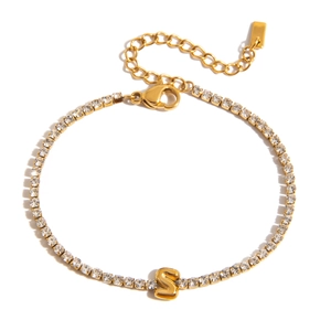 Detail of 18K gold S-letter bracelet with pave zircon crystals and lobster clasp