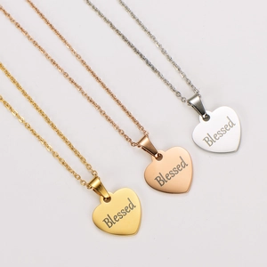 Three minimalist blessed heart pendant necklaces in gold, rose gold and silver finishes