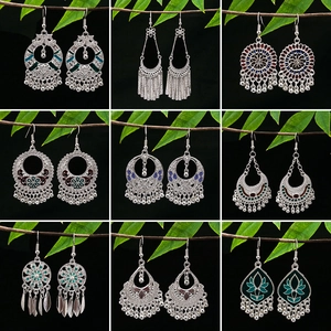 Bohemian silver alloy earrings set featuring vintage ethnic hollow designs and tassels