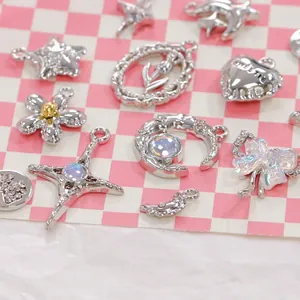 Silver alloy charms set featuring stars, moon, crosses, and bows for DIY jewelry making
