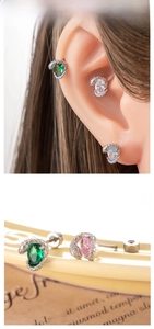 Detailed view of snake stud earrings with colorful oval zircon and screw ball back