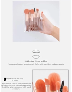 Detail view of 8-piece makeup brush set with soft orange bristles and matte pink handles
