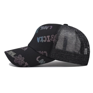 Black mesh trucker hat with colorful sequins featuring Lucky lettering and floral patterns
