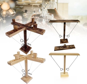 Detail view of wooden hook and ring toss game set with different styles and finishes