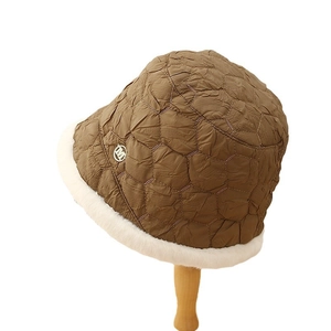 Quilted khaki winter fisherman hat with white faux fur trim and metal M logo