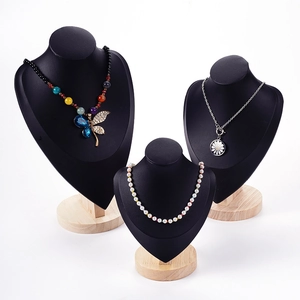 Three professional black leather portrait busts for jewelry and necklace display on wood base