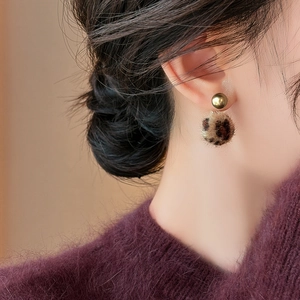 Leopard print plush ball earrings with gold studs for a stylish vintage autumn look