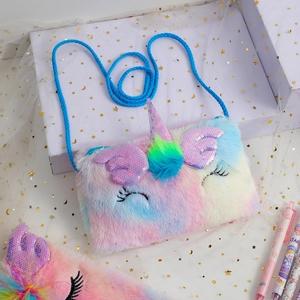 Close-up of rainbow plush unicorn bag with sequin horn and woven shoulder strap