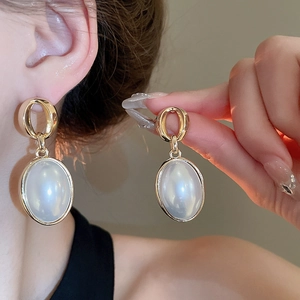 French vintage gold hoop earrings with white oval faux pearl drops for an elegant look