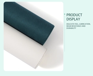Detail of 3-tier jewelry display showing smooth green and white faux leather texture