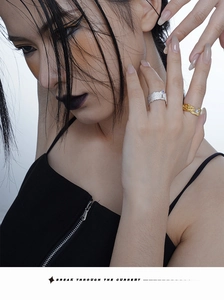 Detailed shot of S925 sterling silver textured rings with inset blue and purple gems