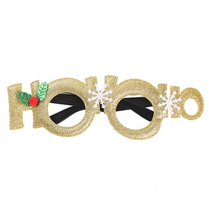 Occhiali di Natale con scritta dorata HO HO HO glitterata e decoro di agrifoglio