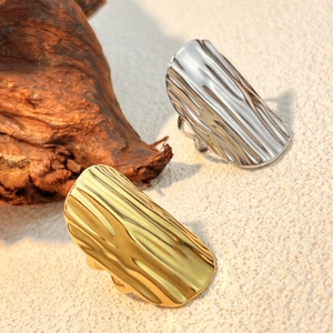 Minimalist wide ripple textured stainless steel rings in gold and silver finish