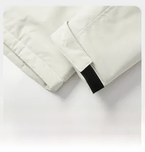 Detail view of adjustable velcro cuffs on beige functional windbreaker jacket