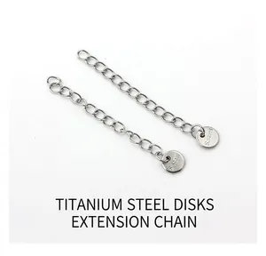 Macro detail of stainless steel extender chains with S.steel engraved round tags