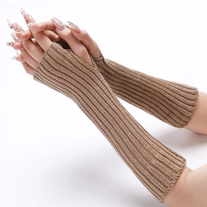 Detailed knit texture of long camel striped arm warmers with thumb hole for winter