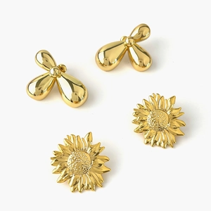 Minimalist golden polished sunflower and drop metallic stud earrings set in high gloss finish