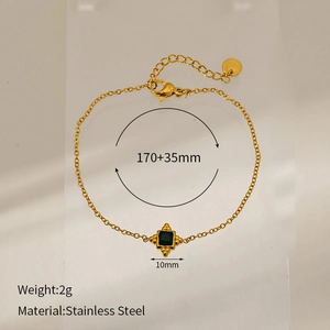 Detail shot of gold-plated stainless steel bracelet with green square gemstone pendant