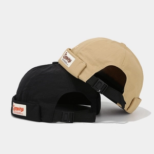 Retro brimless docker hats in black and khaki with camping patch and adjustable strap