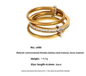 Detailed view of 18K gold plated multi-layer stainless steel ring with zircon accents