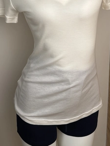 Detailed close-up of white V-neck T-shirt in Tencel wool fabric on a mannequin